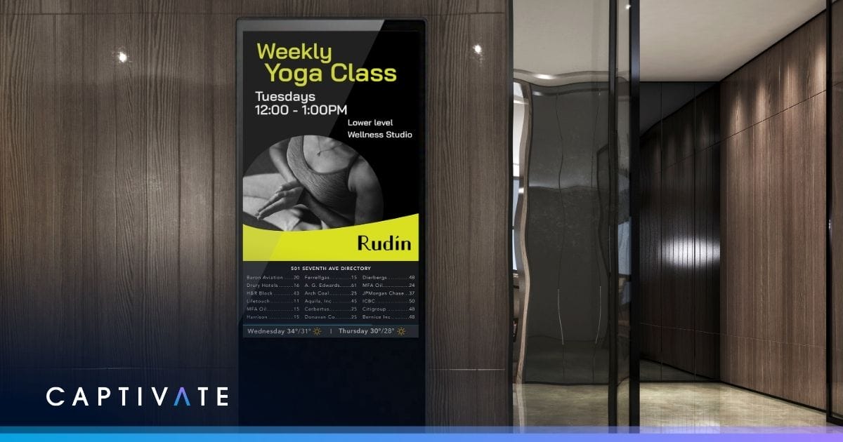 Digital sign advertising a weekly yoga class on Tuesdays at a wellness studio.