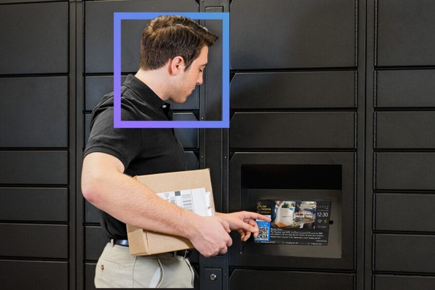 Man holding a package while using a locker system for parcel delivery or pickup.