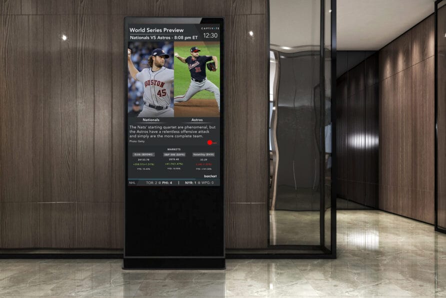 Digital display screen showing baseball player statistics and images in a modern interior setting.
