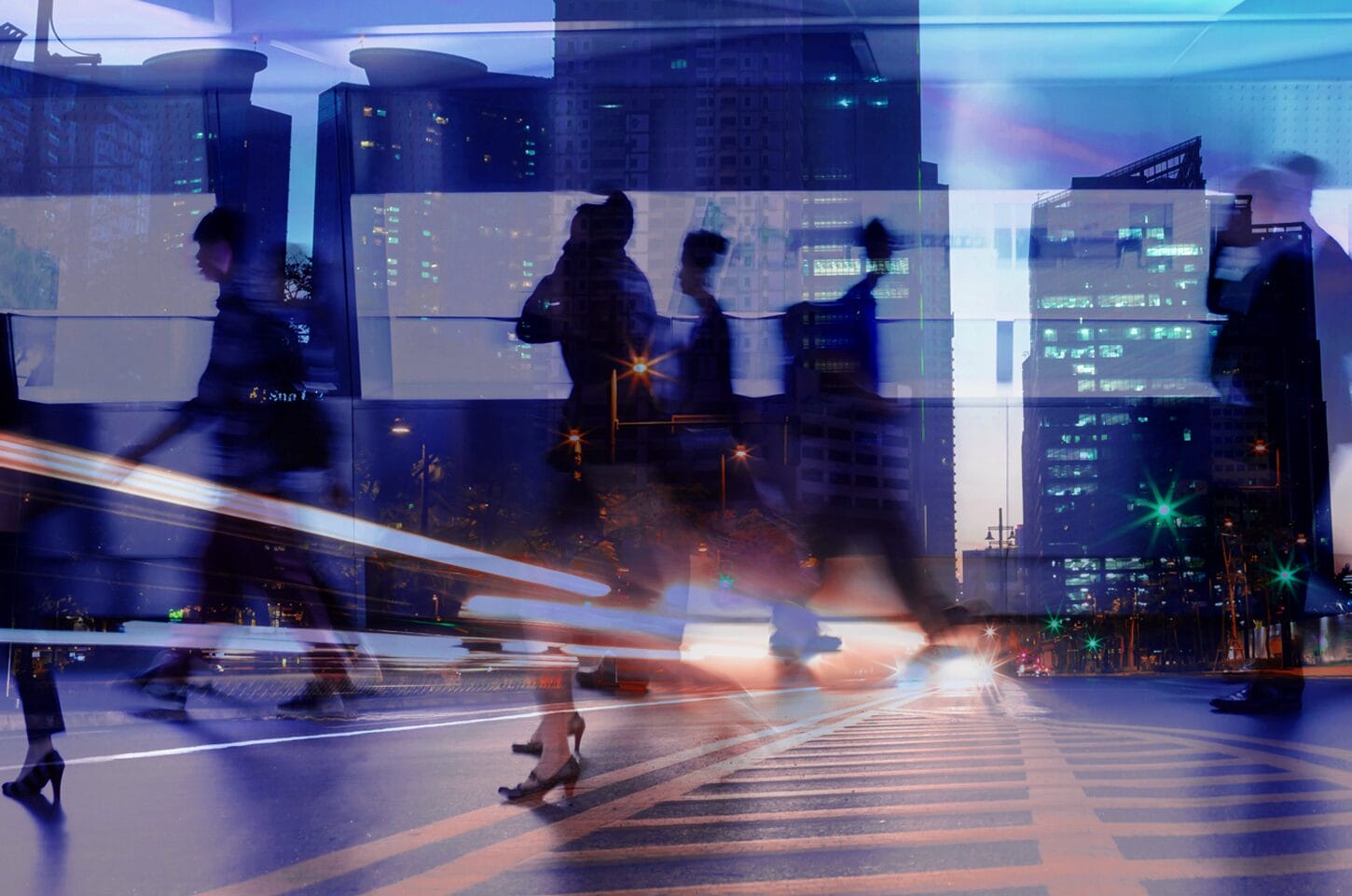 Silhouettes of people walking on a city street with skyscrapers in the background, reflecting urban hustle and bustle.