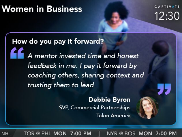 Television screen showing program "Women in Business," featuring mentorship advice from a speaker named Debbie Byron.