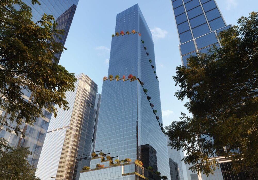 A modern glass skyscraper with surrounding trees and adjacent tall buildings under a clear blue sky.