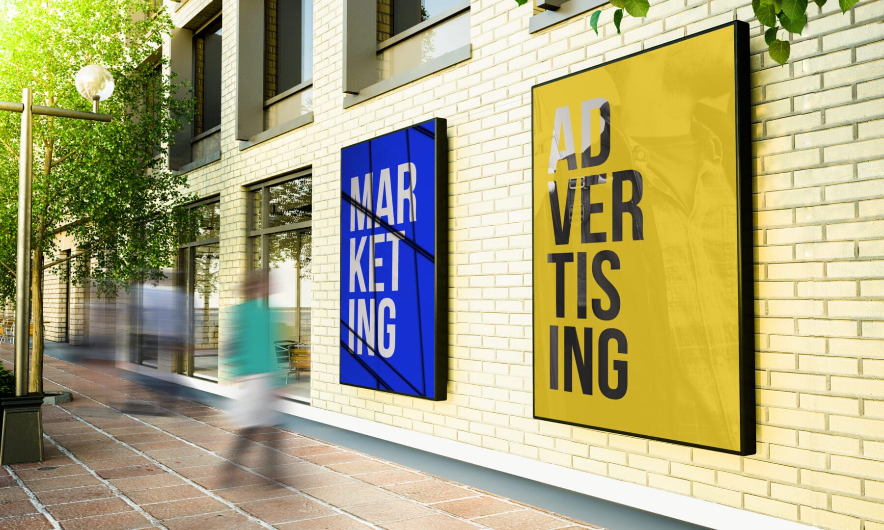 Street view with motion-blurred people passing modern marketing and advertising posters on a brick wall.