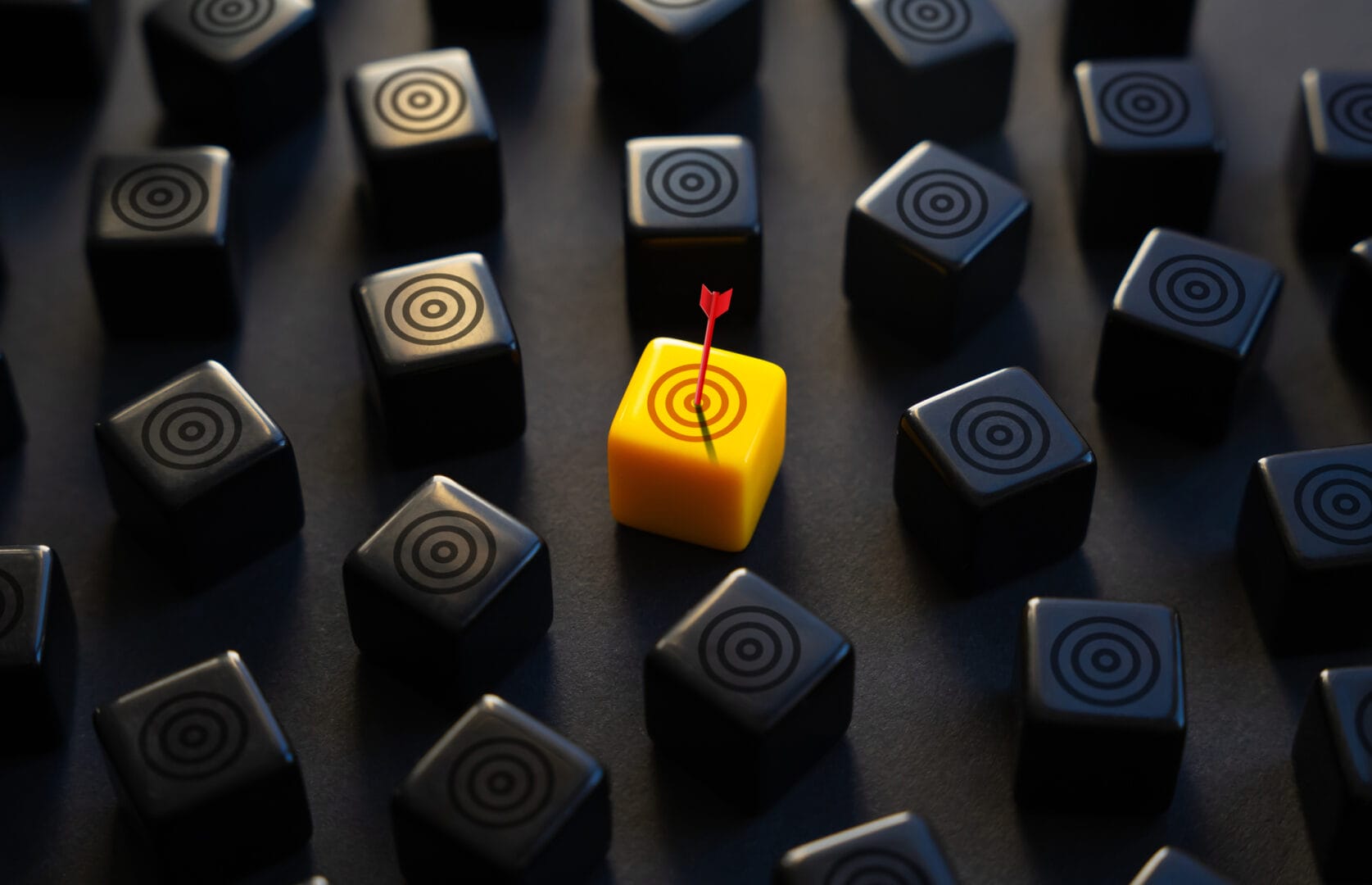 Yellow cube with a red arrow among black cubes, highlighting the concept of standing out or achieving a target.