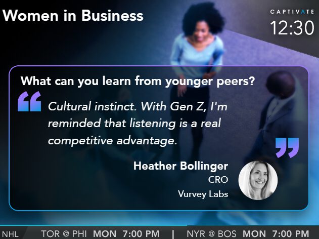 TV screen showing quote on learning from younger peers, with visible news ticker and blurred figure in the background.