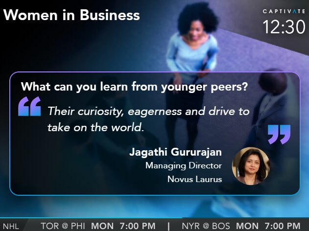 Television screen showing a discussion on women in business with a quote by Jagathi Gururajan, Managing Director.
