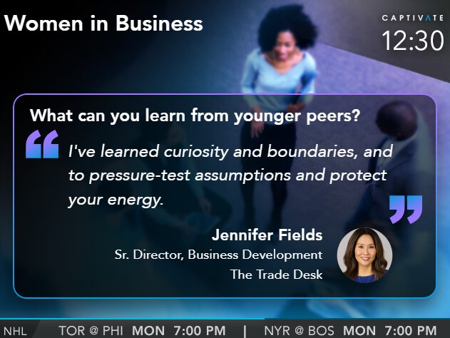 TV screen showing Women in Business interview with Jennifer Fields, discussing the importance of curiosity and boundaries.