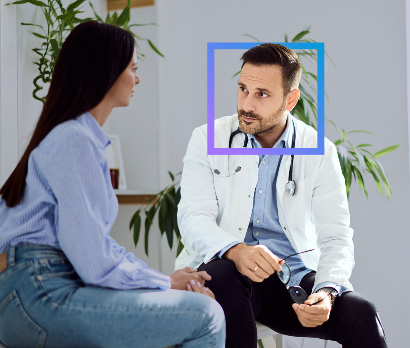 Doctor consulting with a patient in a bright office setting with plants in the background.