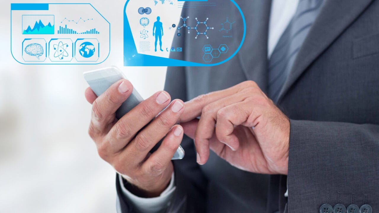 Businessman using a smartphone with futuristic digital health and data interface holograms displayed in the air.