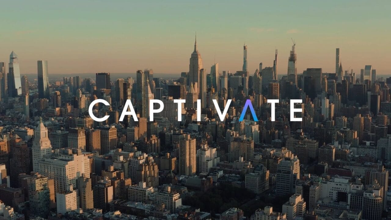 City skyline at sunset with the word "Captivate" overlaying the image.